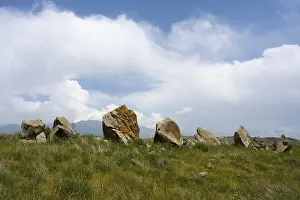 Zorats Karer Megaliths Drucke: Stone formations in a meadow under a cloudy sky