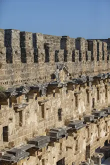 Historic Building Elements Drucke: Part of the stone wall of the ancient amphitheater with architectural elements