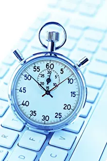 Empty Office Space Drucke: A stopwatch lies on the keyboard of a computer