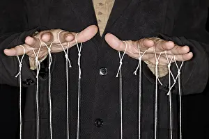 Black Background Studio Photography Drucke: String-pulling puppeteer, studio photography with black background