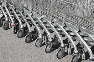 Shopping Mall Scene Drucke: A string of shopping carts outdoors
