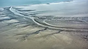 Top Down View Of Coastline Drucke: Structures in the sand formed by wind and water