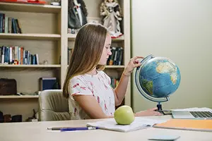 Educational Institution Training Drucke: Student posing with globe table