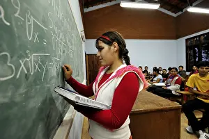 Youth Education Drucke: Student solving a math equation