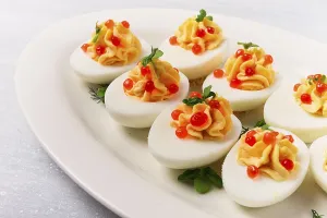 Stuffed Eggs Drucke: Stuffed eggs, with red caviar, micro greenery