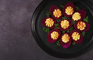 View From Above Food Photography Drucke: Stuffed eggs, stained with beetroot juice