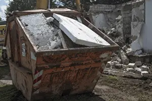Abandoned Construction Site Drucke: Styrofoam placed in a construction waste container