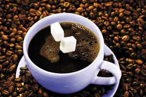 Hot Beverage Studio Shot Drucke: Sugar cubes falling into a cup of coffee