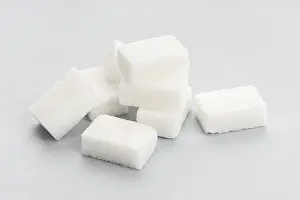 Gray Background Food Photography Drucke: Sugar cubes on gray background. Close up