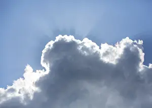 Cloudy Daytime Scene Drucke: Sun behind a cloud in the blue sky