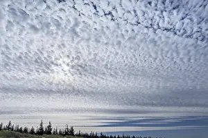Cloudy Day Europe Drucke: Sun behind a cloud cover (Altocumulus)