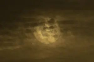 Cloudy Skies England Drucke: Sun behind thin clouds in the sky