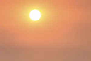 Evening Atmosphere Drucke: Sun in cloudy sky, shortly in front of sunset