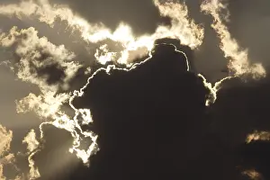 Stormy Sky Drucke: Sun behind dark storm clouds