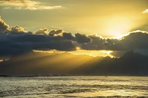 French Overseas Territory Landscapes Drucke: Sun rays breakig through the clouds over Moorea