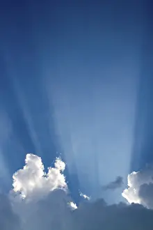 Cloudy Atmosphere Drucke: Sun rays behind clouds