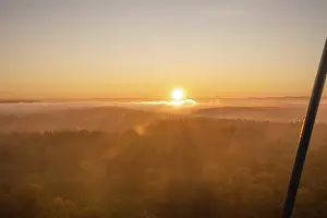 Morning Light In Southern Germany Drucke: The sun rises over misty forests