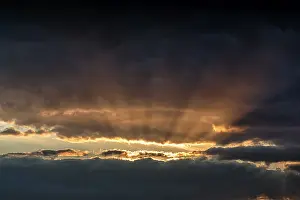 Swedish Evening Sky Drucke: Sunbeams behind clouds, dramatic evening sky