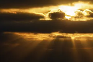 Uninhabited Cloudy Skies Drucke: Sunbeams shining through clouds