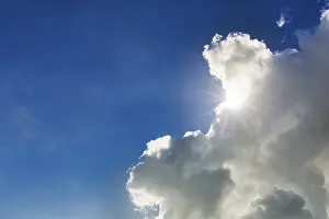 Schleswig Holstein Scenery Drucke: Sunbeams shining through a cumulus cloud