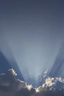 Deserted Landscape Germany Drucke: Sunrays behind a dark cumulus cloud, Germany