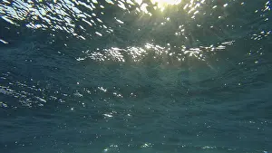 North African Evening Sky Drucke: Sunrays penetrate through the surface of the water
