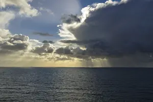 Northern Germany Landscapes Drucke: Sunrays shining through clouds over the sea