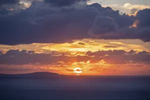 Deserted Greek Island Drucke: Sunrise behind the clouds, atmospheric dramatic cloudy sky