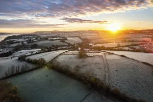 British Countryside Aerials Drucke: Sunrise over Fields and River Teign from a drone