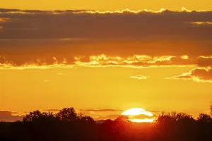 Cloudy Skies Central Europe Drucke: Sunrise, sky and clouds orange, Thuringia, Germany