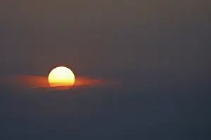 Empty German Countryside Drucke: Sunrise, sun emerging from a gap in the clouds