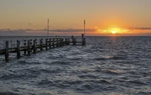 Wooden Bridge Germany Drucke: Sunset on the beach of Utersum