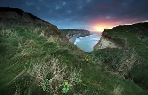 Atmospheric Landscape Photography Drucke: Sunset over cliffs in ocean, Etretat
