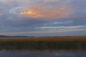 Cloudy Sky Germany Drucke: Sunset with cloud formation on the Trebel River