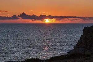 Cloudy Sky Landscape Drucke: Sunset behind clouds on the Atlantic Ocean