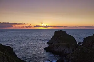 Backlit Landscape Photography Drucke: Sunset behind clouds on the Atlantic Ocean