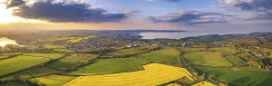 Evening Light In England Drucke: Sunset over Devon Fields and Farmlands from a drone