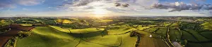 High Angle View Of Devon Fields Drucke: Sunset over Devon Windmill from a drone