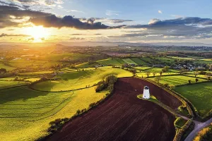 Drone Shot Of Devon Fields Drucke: Sunset of Devon Windmill over Fields and Farms from a drone