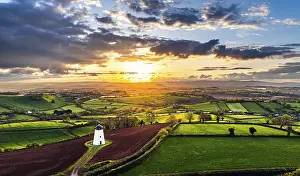 Drone Photography UK Landscape Drucke: Sunset of Devon Windmill over Fields and Farms from a drone