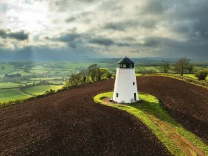 Agricultural Landscape From Above Drucke: Sunset of Devon Windmill over Fields and Farms from a drone
