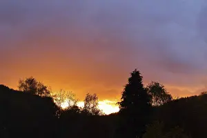 Dark Clouds Germany Drucke: Sunset with dramitic dark clouds