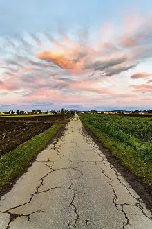 Austrian Countryside Landscape Photo Drucke: Sunset over fields and Austrian village with dramatic sky and colorful clouds