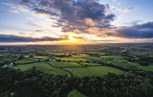 Sunset Landscape Drucke: Sunset over Fields and Farms from a drone