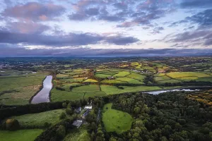 Sunset Aerial View Drucke: Sunset over Fields and Farms from a drone