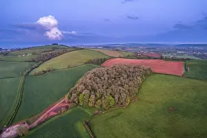 Evening Atmosphere In England Drucke: Sunset over fields and farms from a drone