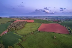Evening Light Landscape Photo Drucke: Sunset over Fields and Farms from a drone