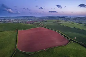 Aerial View Of Devon Drucke: Sunset over fields and farms from a drone