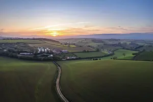 Drone Photography Devon Drucke: Sunset over fields and Widdicombe Farm from a drone