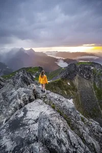 Wetterstein Mountains Drucke: Sunset, hiker looking at mountains and peaks under dramatic clouds